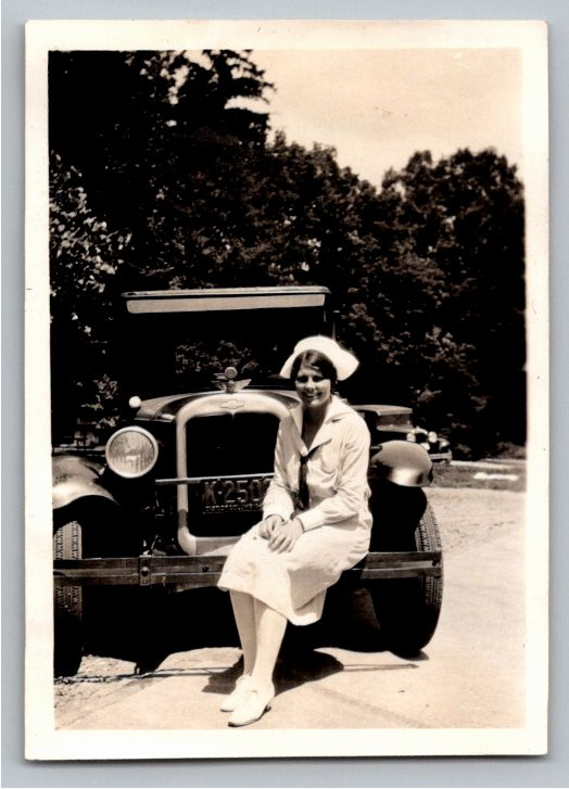 Vintage 1920s Nurse Seated on Mid-1920s Chevrolet B&W Snapshot